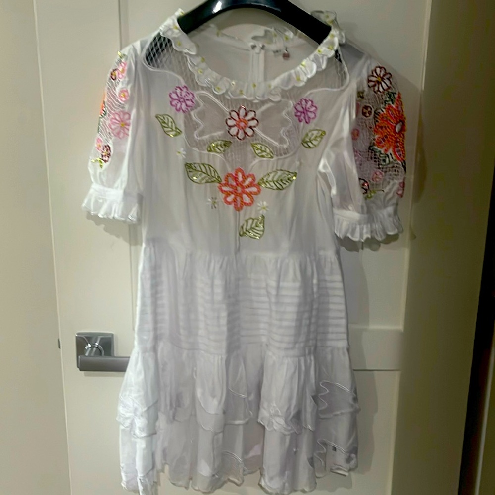 Never worn brand new white dress with sequins. Beautiful flowers